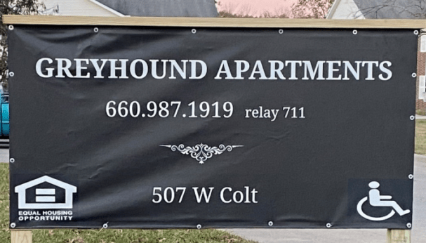 greyhound apartments sign
